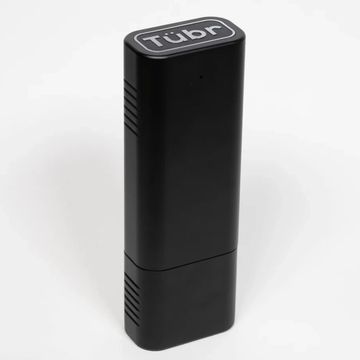 A sleek black device labeled 'Tübr' with a modern, minimalist design.