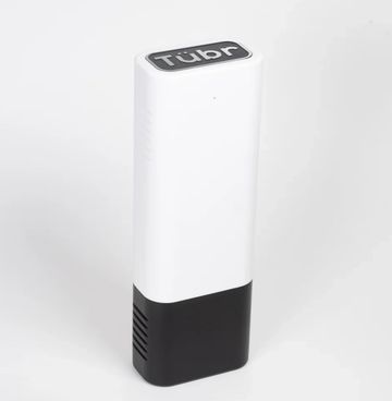 A white and black rectangular device labeled 'Tübr' on top.