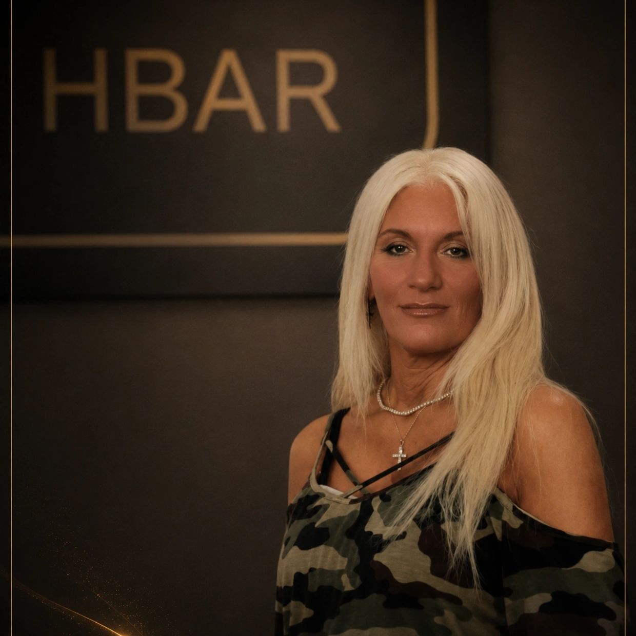 Woman with blonde hair in camouflage top at HBAR.