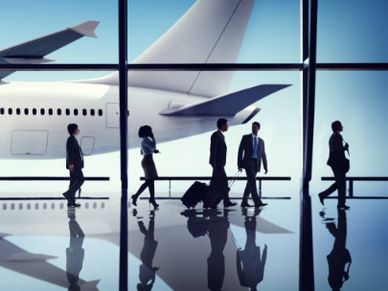 Corporate travellers in an airport waiting to board their plane