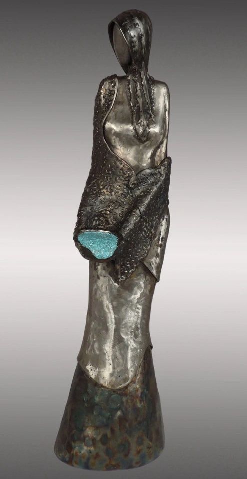 Metal woman pouring turquoise water