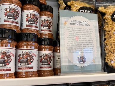 Beechwood Brothers BBQ spices and sign on shelf.