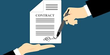 Hand signing a contract document held by another hand.