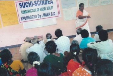 Community meeting on model toilet construction.
