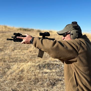 Standing position TC100 showing support hand placement, Firearms training