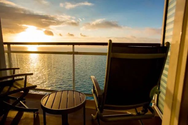 Sunset view from a dock lounge chair on a South Pacific cruise voyage