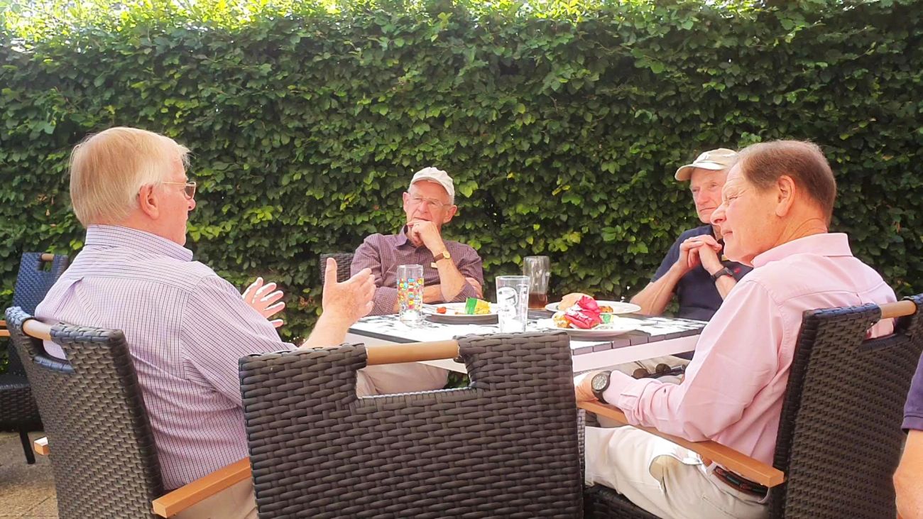 Club members dining together at an evening social event