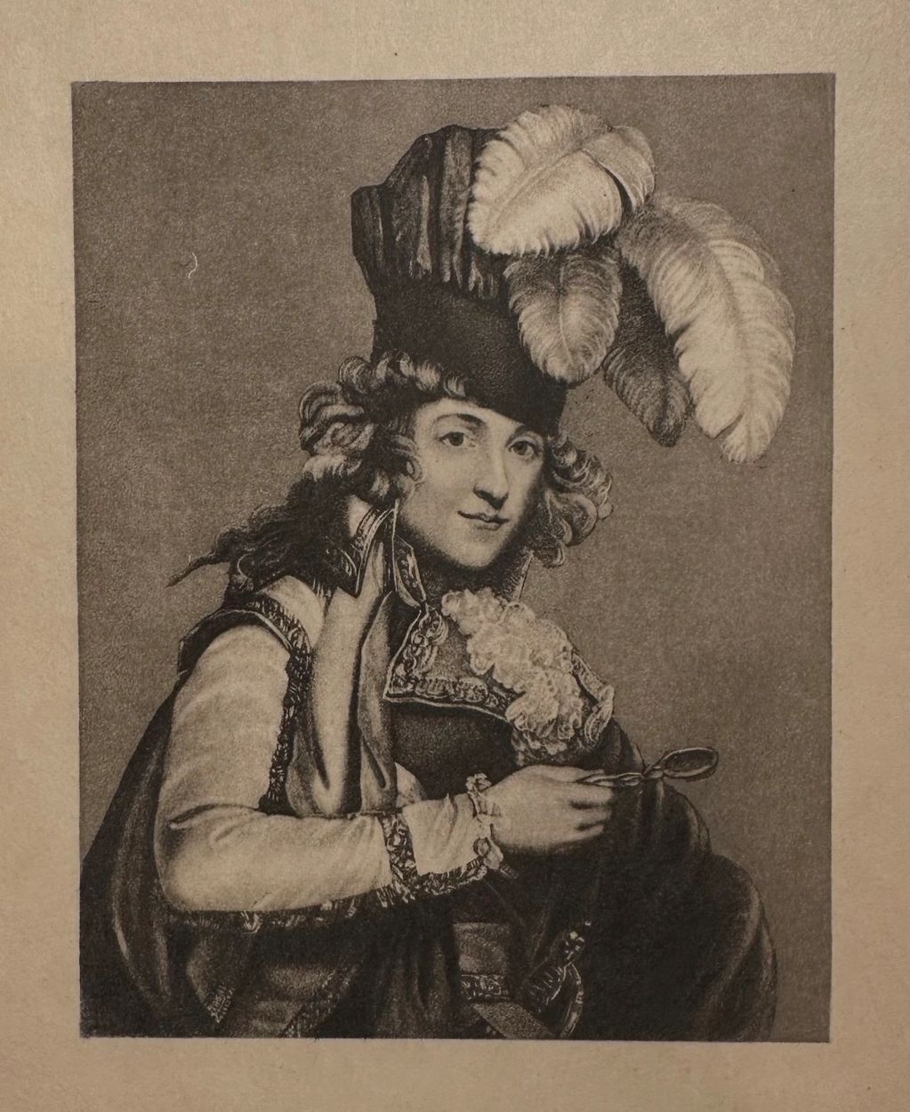 Portrait of a historical figure in elaborate attire with a feathered hat.