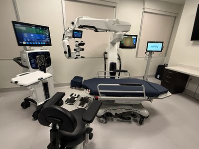 Completed office-based surgery suite built by EYE SUITES, with ophthalmic microscope and surgical be