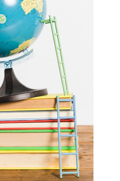 globe stacked on books with a ladder