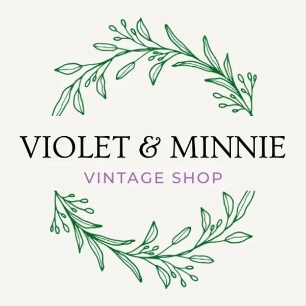 Elegant vintage shop logo with floral design and classic typography.