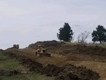 Building road. Driveway grading. Dozer work.