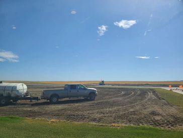 Water tank. Dirt work. Grading dirt.