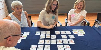 A group of people playing card games
