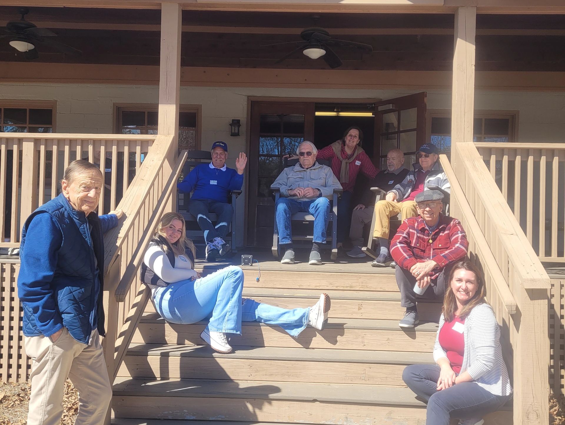 Staff and participants on the steps and porch of the Tulip Place
