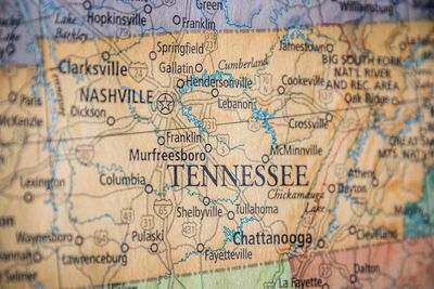 Close-up of a Tennessee state map highlighting cities and highways.