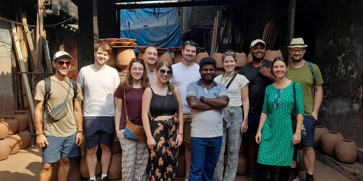 A group picture after Dharavi slum Tour at Kumbha Wada, it is a pottery industries of Dharavi 