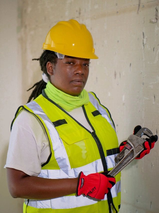 a plumber holding a wrench