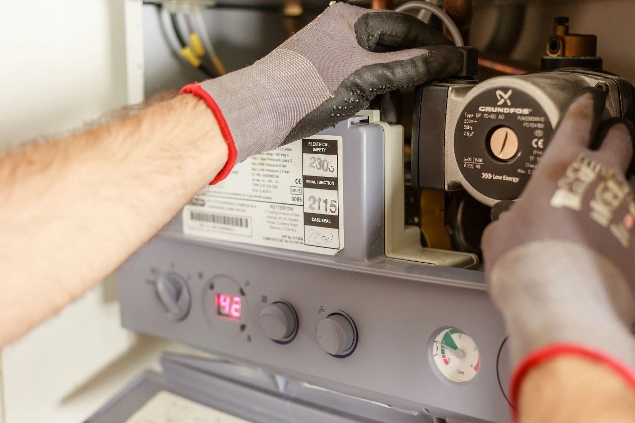 a plumber repairing a power source