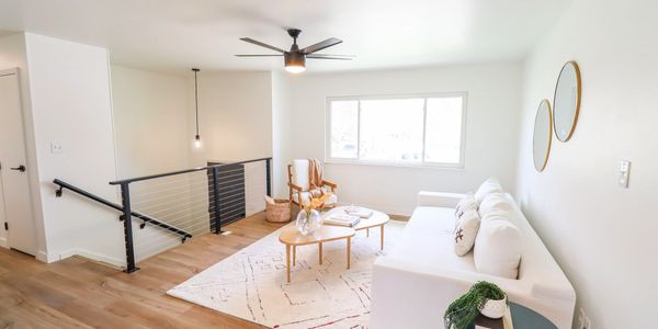 Mid century modern renovated home local to fort collins Colorado. Matte black accents / luxury plank