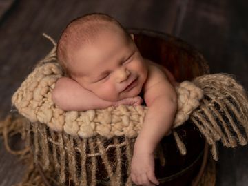 Maricopa Newborn posed in wooden bucket