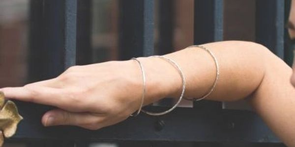Lady’s arm with Argentium silver bangle bracelet set