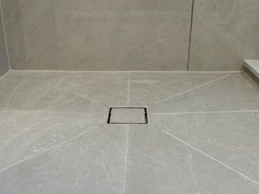 Square Drain with pocket cut tiles.