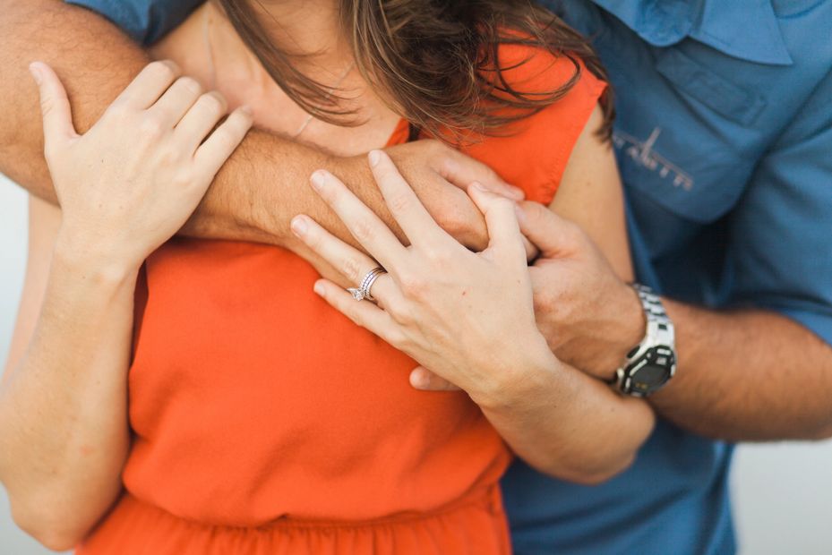 Man hugging a girl from the back