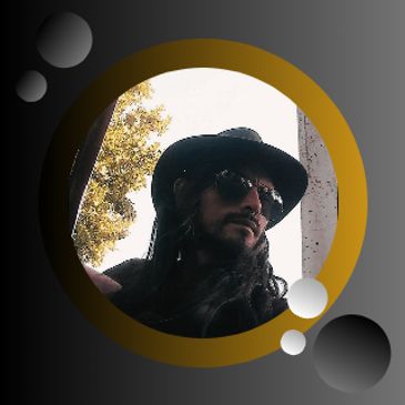 Man with long hair and sunglasses wearing a black hat.