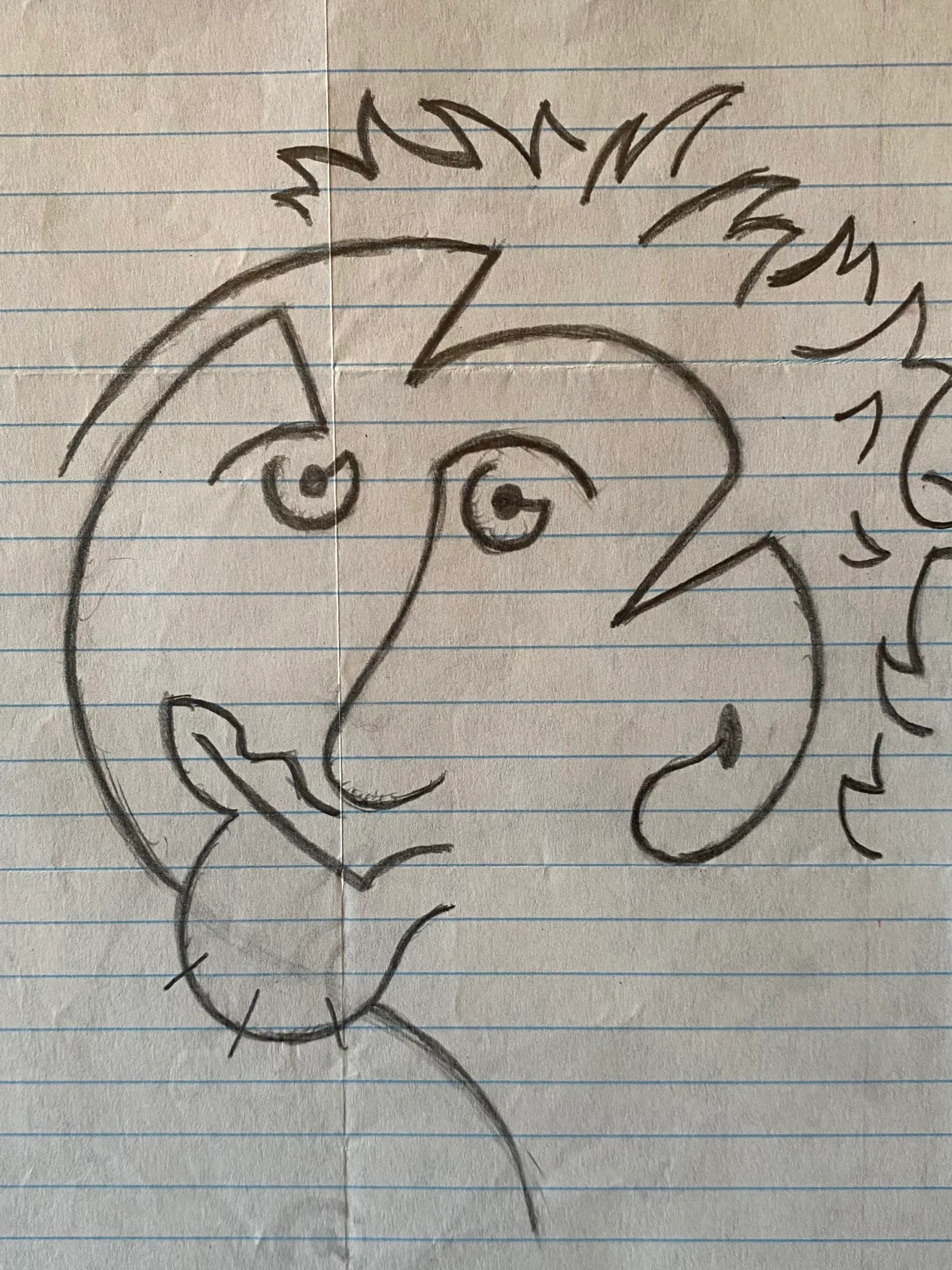 A playful hand-drawn doodle of a smiling clown face on lined paper.