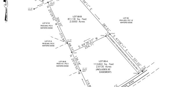 A detailed survey map showing multiple land lots with measurements and boundaries.