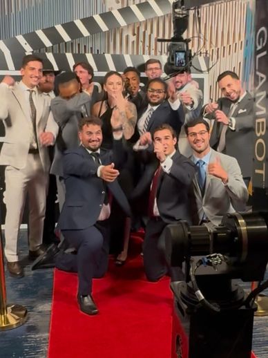 GlamBot rental Dallas group of guests on red carpet, cinematic slow-motion video at a luxury event.