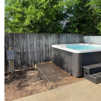 A hot tub with a code compliant electrical connection and disconnect.