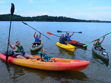 Family kayaking in the Greaty Smoky Mountains of  Gatlinburg, Pigeon Forge, Sevierville Tennessee <a