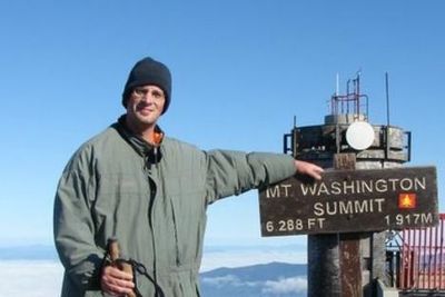 Pastor Jeremy Pekari at the Summit of Mt. Washington in the winter.