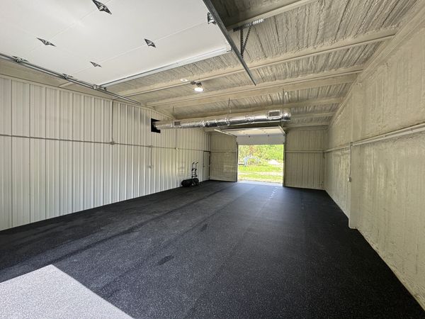 Warehouse area with black rubber rolls covering floor to enhance the style in Thomasville Georgia.