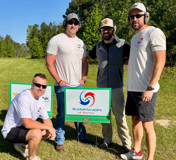 Group image of employees in local charity event showcasing teamwork and giving back to community.