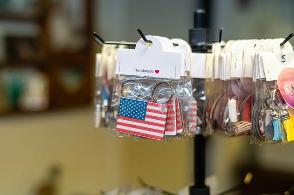 Festive holiday decor featuring unique marbled ornaments on a display stand.

