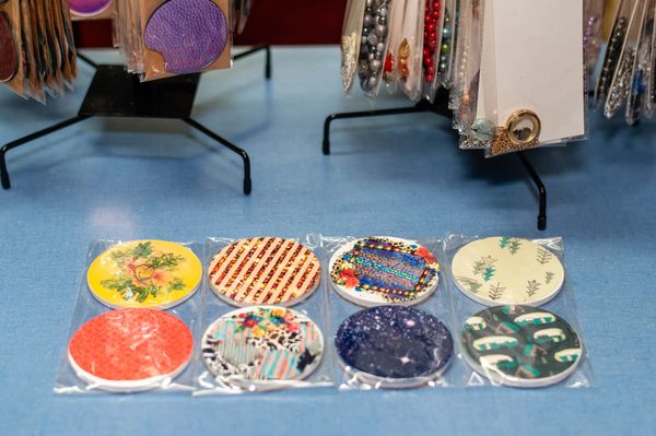 Artisanal marbled glass Christmas tree ornaments for festive holiday decorating.

