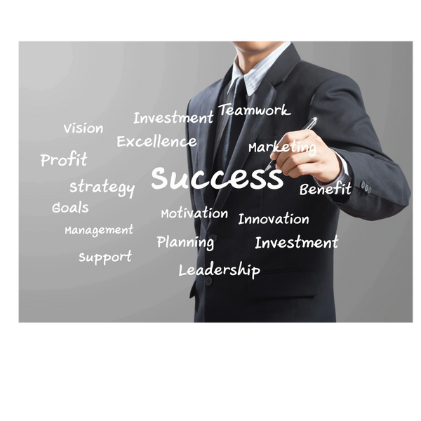 Businessman writing success-related words on transparent board.