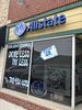 Allstate insurance office with large window signs.