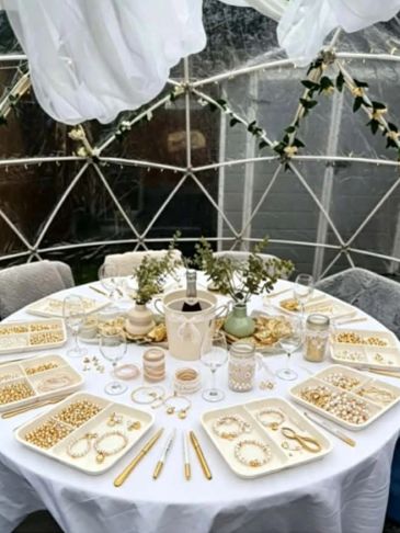 Jewelry craft setup on a round table.
