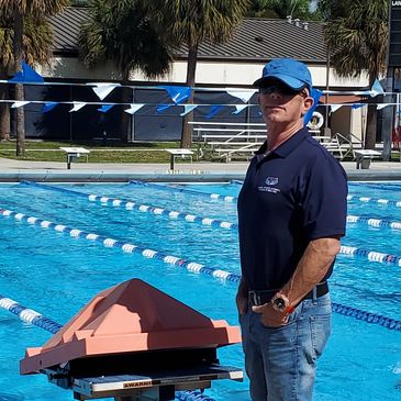Coach JR on the pool deck teaching and coaching Masters Swim at FAU
