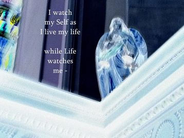 Colour photo-panel of a statuesque figure looking down from a stone wall, with a poetic quote within