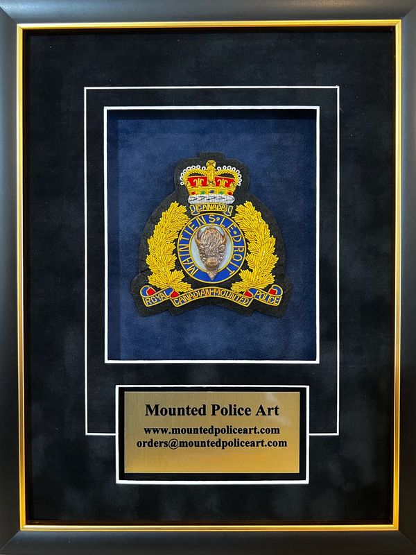 Framed Royal Canadian Mounted Police badge with contact details below.