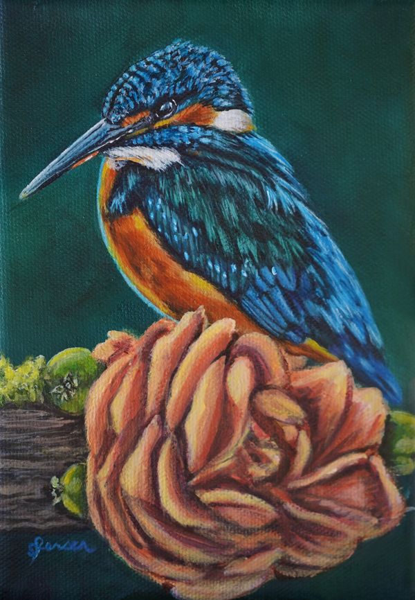 Kingfisher sitting on a perch with a coral, pink flower. Rose. 