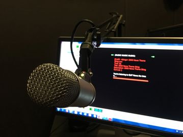 Microphone in front of a computer.