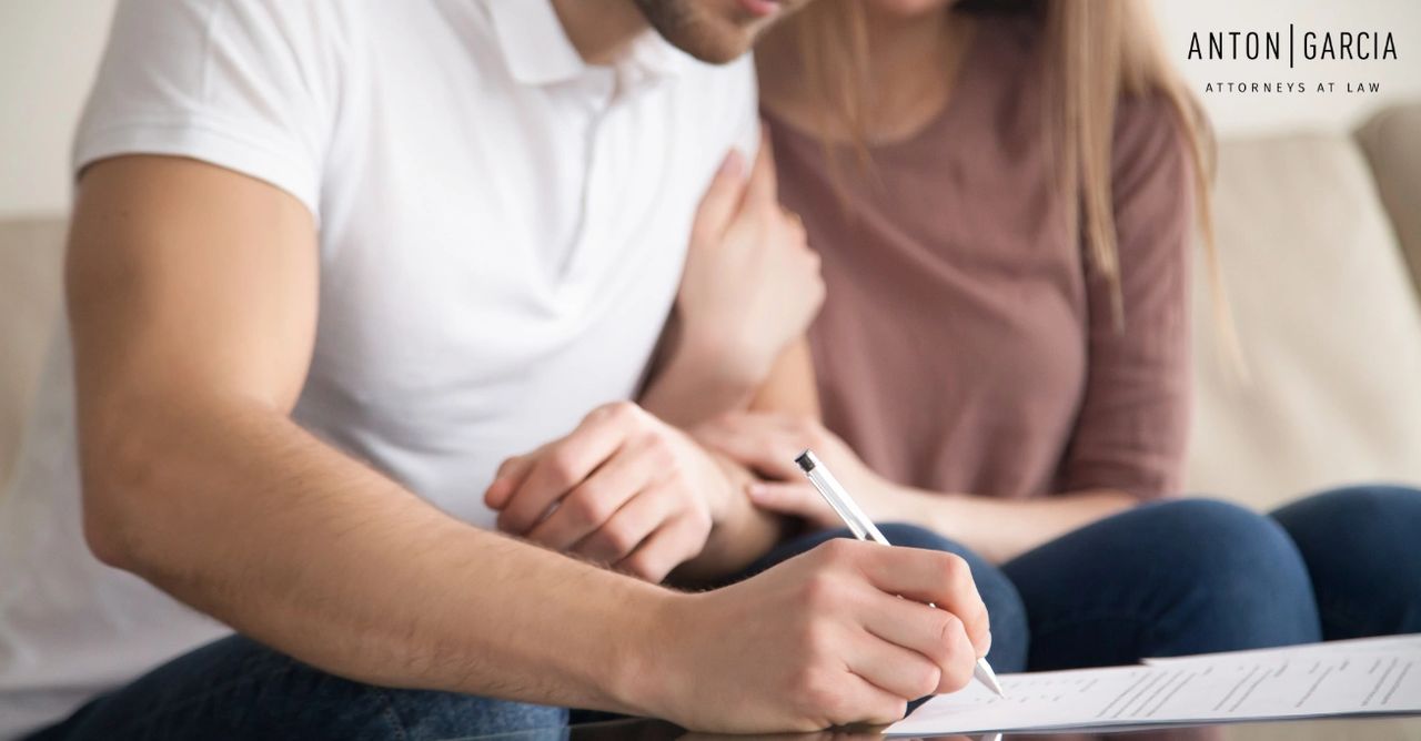 couple signing prenup