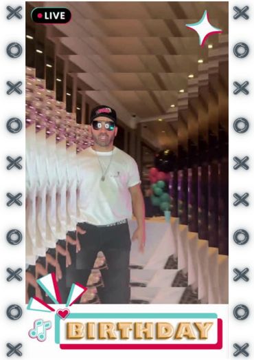 A guy posing in the photo booth 