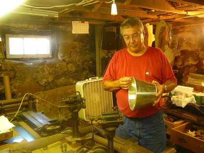 The Tinmaker at the Amana Colonies, where traditional industries are perfected and preserved